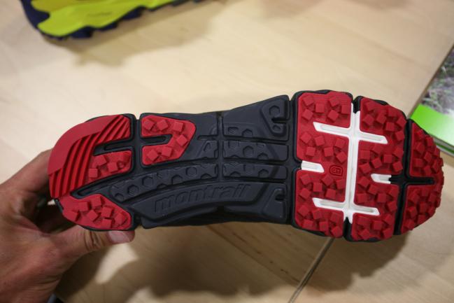 Co-molded EVA rock plate in the forefoot (white color) and harder midsole in the midfoot that you can't see visually but can feel when you hold the shoe.